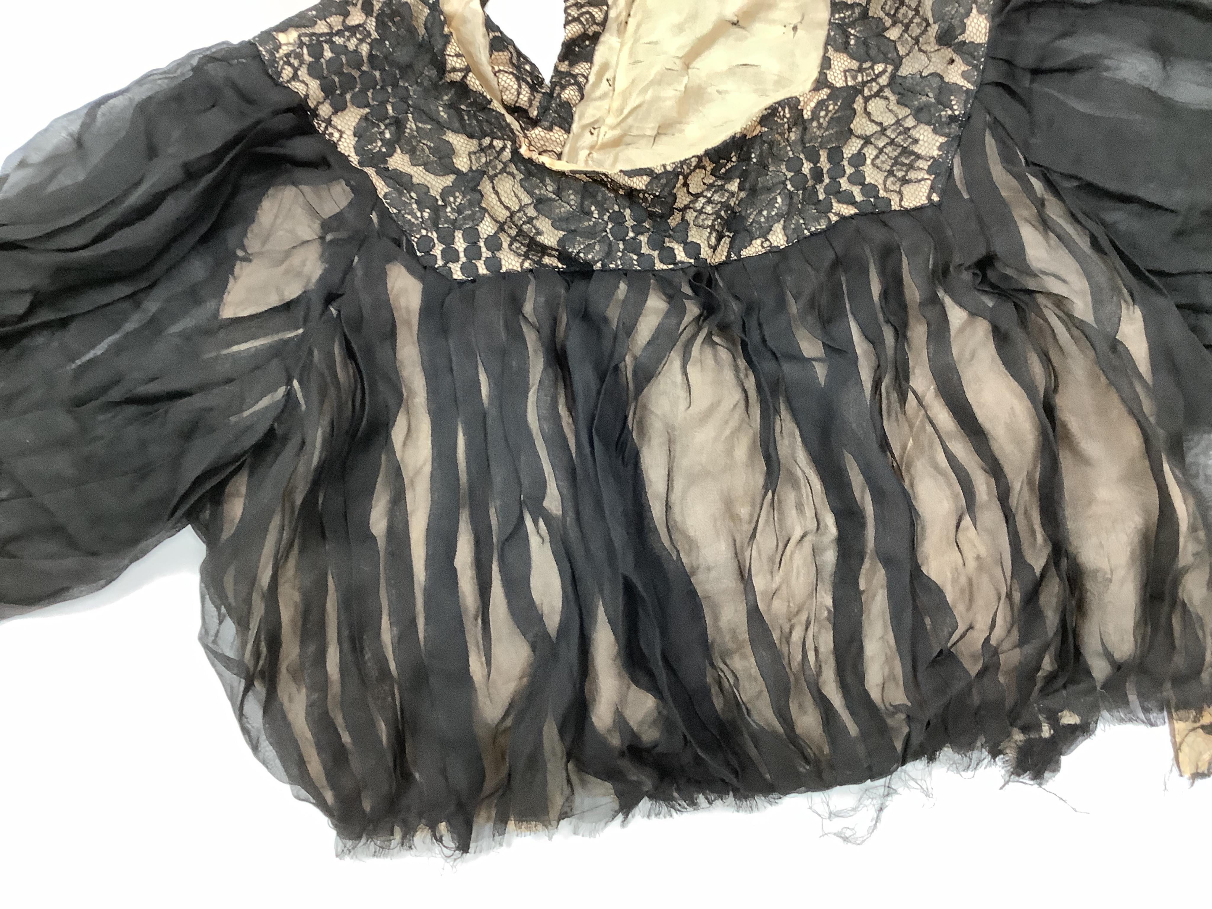 Two Edwardian blouses and three earlier lace camisoles, three black satin partly sewn skirts and later black velvet diamonte decorated evening coat. Condition - the coat, skirts and blouses need repair but are good for T
